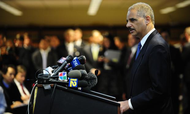US Attorney General Eric Holder attends a press conference at the US Attorney's Office in New York, January 20, 2011.