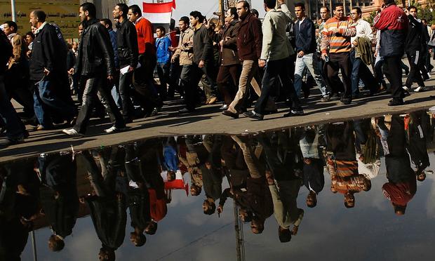 crowd of anti-government protesters in Tahrir Square on the morning of January 31, 2011 in central Cairo, Egypt