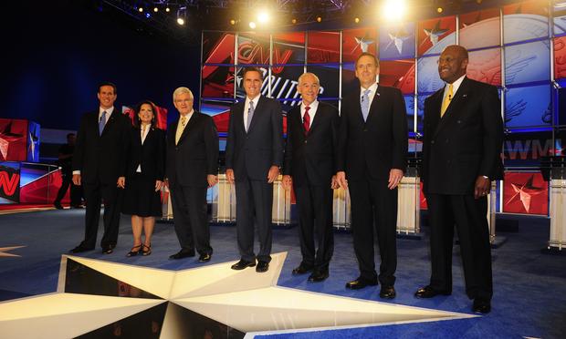 Seven GOP presidential contenders on the stage before the Republican presidential debate in Manchester, New Hampshire on June 13, 2011.