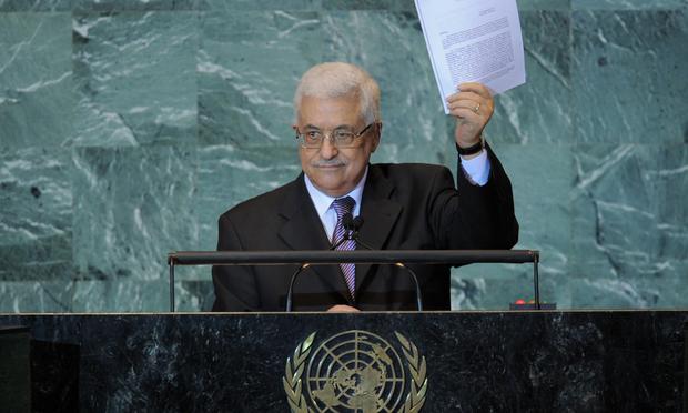 Mahmoud Abbas, President of the Palestinian Authority, holds a copy of the letter requesting Palestinian statehood as he speaks during the United Nations General Assembly September 23, 2011 at UN head