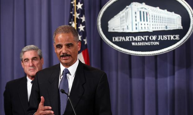 Attorney General Eric Holder (R) and FBI Director Robert Mueller (L) announce a plot was foiled involving men allegedly linked to the Iranian government to kill the Saudi ambassador to the U.S.