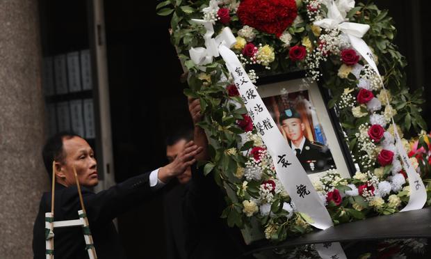 A portrait of Army Pvt. Danny Chen is placed on a car in his funeral procession in Chinatown on October 13, 2011 in New York City.