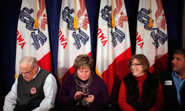 Supporters wait for the arrival of former Massachusetts Governor and Republican presidential candidate Mitt Romney for a rally at the Hotel Blackhawk December 27, 2011 in Davenport, Iowa.