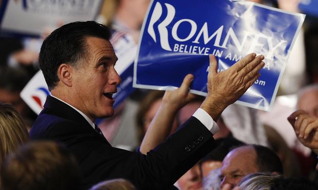 Mitt Romney greets supporters after addressing a primary night victory rally in Manchester, New Hampshire.