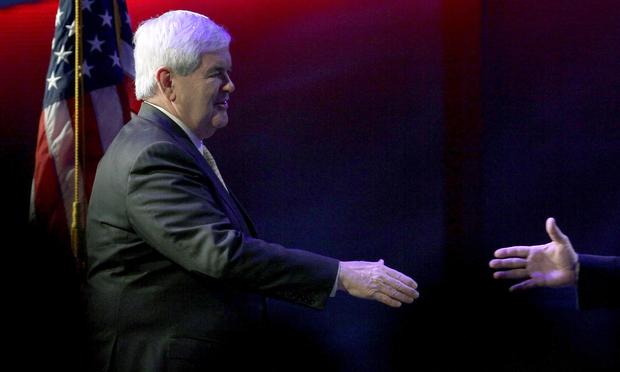 Newt Gingrich reaches to shake hands during a campaign stop in Charleston, South Carolina. Republican presidential candidate, former Speaker of the House Newt Gingrich reaches to shake hands during a campaign stop at the Cathedral of Praise on January 15, 2012 in Charleston, South Carolina.