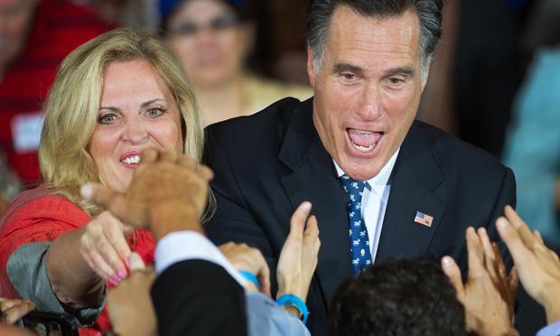 Mitt Romney and his wife Ann greet the crowd gathered at election night headquarters inside the Tampa Convention Center.