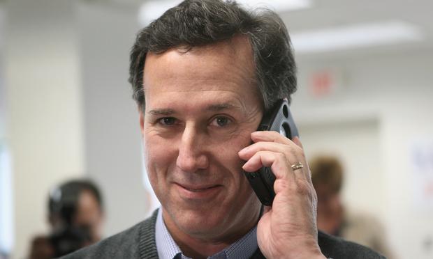Republican presidential candidate, former U.S. Sen. Rick Santorum calls a voter looking for support during a visit to his campaign office on February 28, 2012 in Grand Rapids, Michigan.