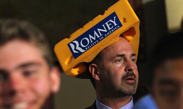 A supporter of Mitt Romney wears a Cheesehead hat during a primary night gathering in Milwaukee.