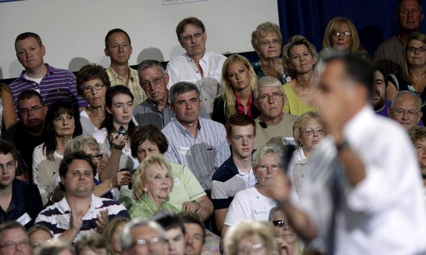 Ohio voters listen to Republican presidential candidate Mitt Romney at a town hall in Bowling Green, Ohio, on July 17, 2012.