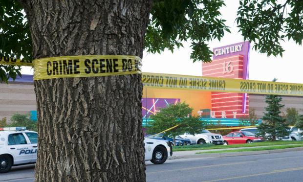 Police cars in front of the Century 16 theater in Aurora, Colorado where a gunman opened fire during the opening of the new Batman movie 'The Dark Knight Rises.'