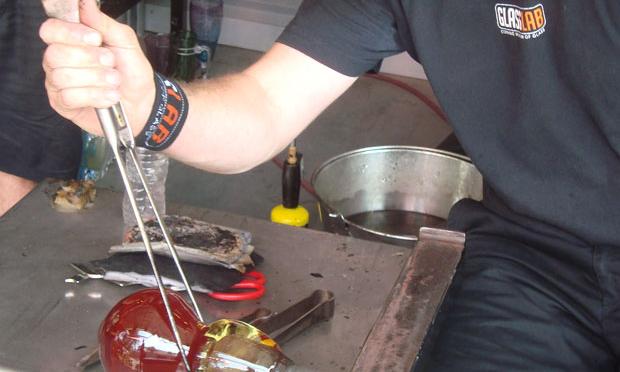 Meek prepares to separate two pieces of glass. Meek prepares to separate two pieces of glass.