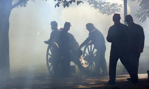 Smoke fills the air after several cannons were fired during a civil war reenactment in Naperville, Illinois