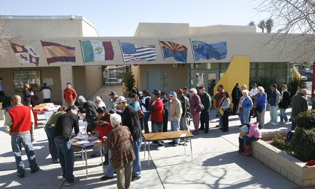 Voters line up to register at a caucus precinct in 2008 in a the largely Hispanic neighborhood in East Las Vegas, Nevada