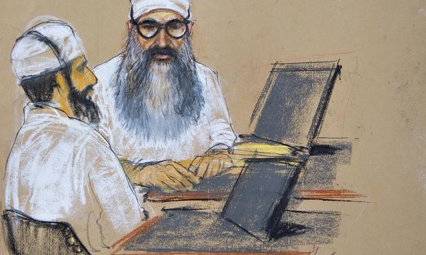 In this sketch by Janet Hamlin, Khalid Sheikh Mohammed and Waleed bin Attash attend their arraignment inside the war crimes courthouse at Camp Justice in Guantanamo Bay on June 5. 2008.