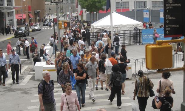 Visitors at the entrance to the 9/11 memorial, newly open to the public, throng the corner of Greenwich and Albany Streets.
