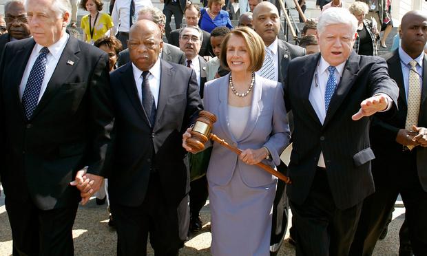 March 21: Speaker of the House Rep. Nancy Pelosi (D-CA) carries the gavel that was used when Medicare was passed by the House in the 1960s.