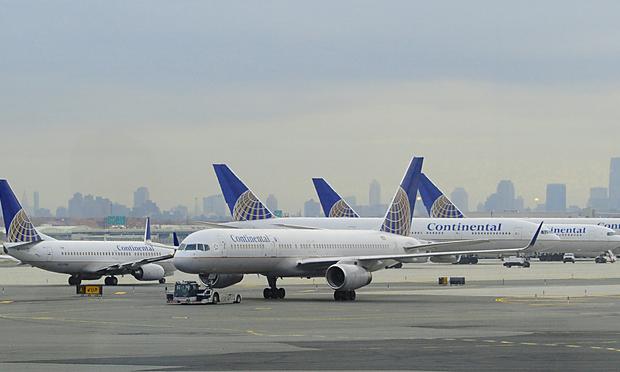 Newark Liberty International Airport This November 24, 2009 photo shows Continental Airlines jets on the tarmac at Liberty International Airport in Newark, New Jersey. THe New York City skyline is in the background.
