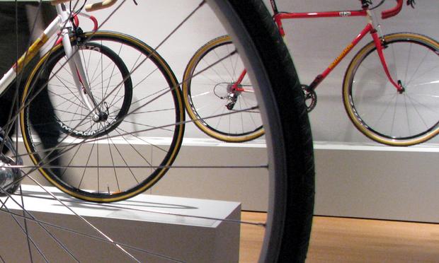 The Museum of Arts & Design's custom bike exhibit -- as seen through the spokes of the Vanilla Randonneur Bicycle (2010)