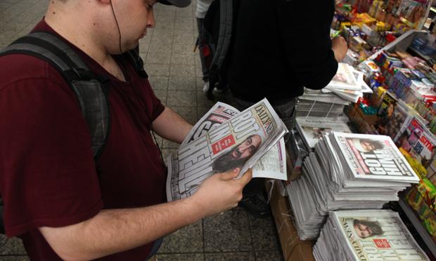 Brad Rousse, 26, buys several newspapers the day after bin Laden was killed.
