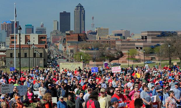 Tea Party demonstrators gather outside of the Iowa capitol building in Des Moines