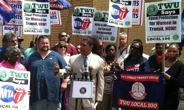 Senator Adriano Espaillat, center, speaks during a rally alongside TWU Local 100 president John Samuelsen, left.