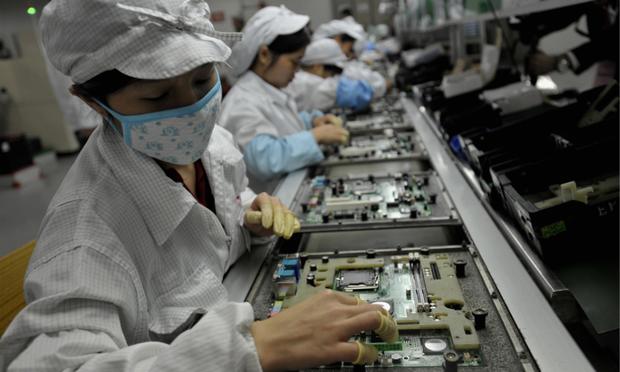 Chinese workers assemble electronic components at the Taiwanese technology giant Foxconn's factory in Shenzhen.
