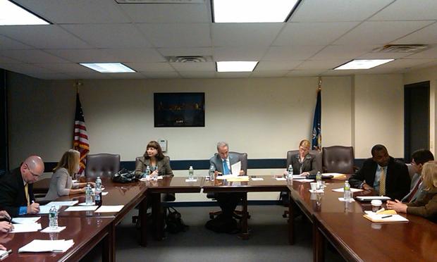 Education Commissioner David Steiner (center) surrounded by staffers and members of the advisory panel considering whether Cathie Black should be NYC schools chancellor.