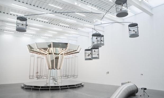 Carsten Höller's Mirror Carousel, Singing Canaries Mobile, and Untitled (Slide) at the New Museum Carsten Höller's Mirror Carousel (left), Singing Canaries Mobile (top right), and Untitled (Slide) (bottom right) at the New Museum