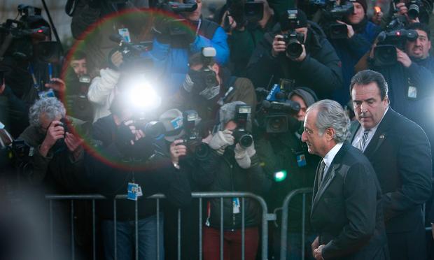 Disgraced financier Bernard Madoff passes a police barricade as he arrives at court on March 12, 2009 in New York City