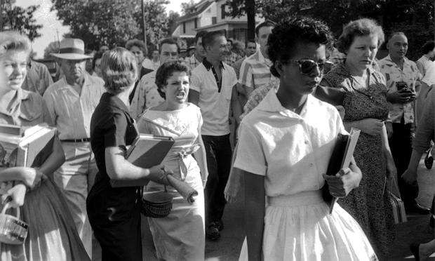 Elizabeth Eckford, followed by an angry crowd after she was denied entrance to Little Rock Central High School, September 4, 1957. The girl in the light dress behind her is Hazel Bryan.