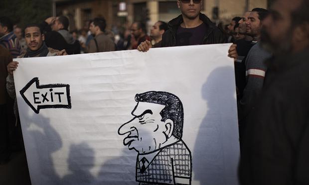 Demonstrators hold a banner with picture of Egypt's President Mubarak.