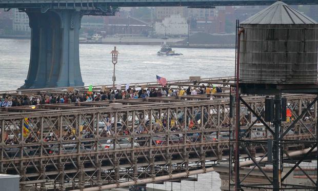 Protesters on the Brooklyn Bridge snarl traffic.