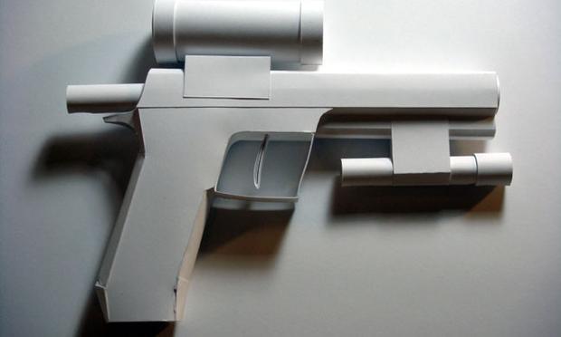 Artist Sarah Frost is showing an arsenal of paper guns at PPOW Gallery, pieces which were crafted using instructional YouTube videos created by boys. Above, a pistol, sculpted from paper and tape.