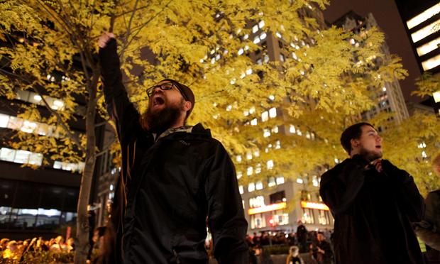 Protesters chanting in Zuccotti Park after being allowed back in.