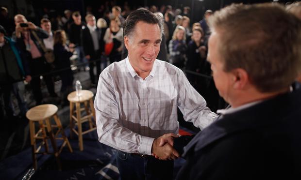 Republican presidential candidate, former Massachusetts Governor Mitt Romney greets supporters during a campaign town hall meeting at the Boys and Girls Club January 5, 2012 in Salem, New Hampshire.