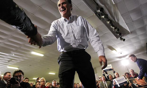 Republican presidential hopeful former Massachusetts Gov. Mitt Romney greets supporters during a campaign rally on January 9, 2012 in Bedford, New Hampshire.