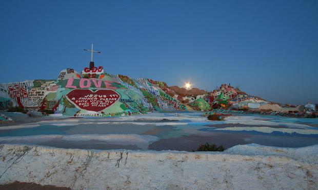 Salvation Mountain, with the moon rising, in 2008. Salvation Mountain, with the moon rising, in 2008.