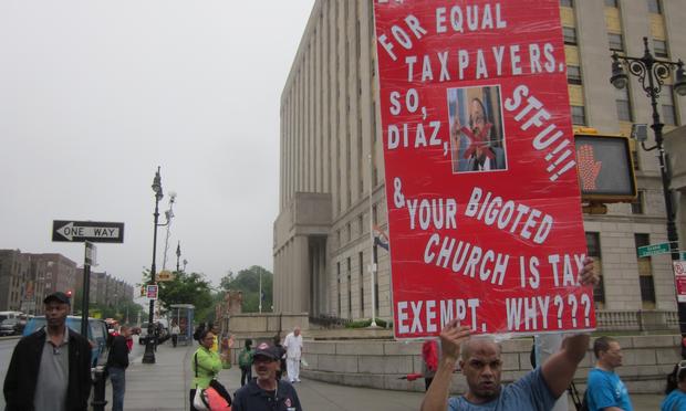 As demonstrators approached the Grand Concourse, they were greeted by Carlos Archie, a supporter of same-sex marriage