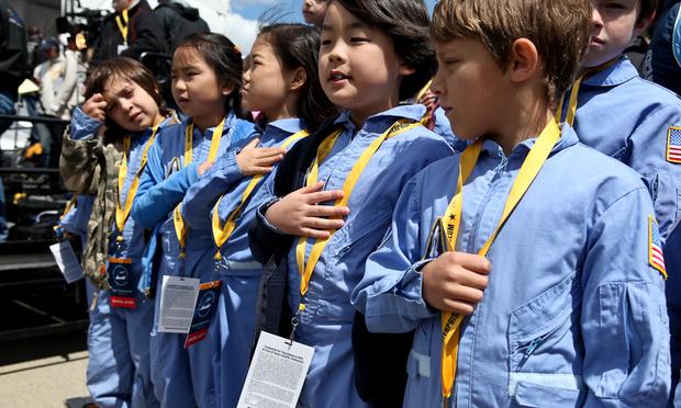 Students watch the shuttle Enterprise arrive at JFK