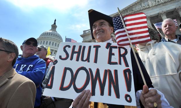 Protesters demonstrate in front of the Capitol Hill in Washington, DC, on April 6, 2011 urging for government spending cut.