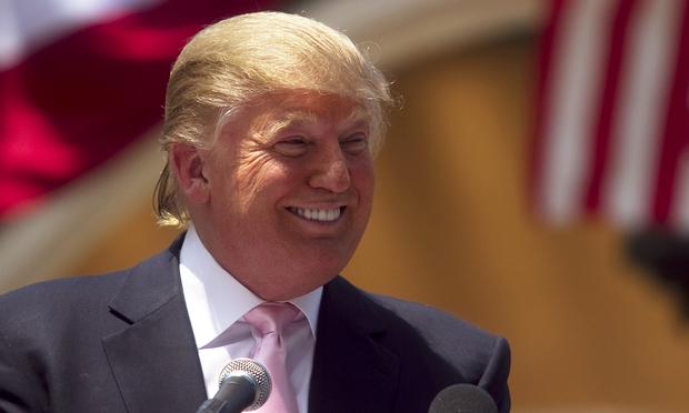 Billionaire Donald Trump laughs while speaking to a crowd at the 2011 Palm Beach County Tax Day Tea Party on April 16, 2011 at Sanborn Square in Boca Raton, Florida.