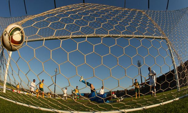 Mark Schwarzer of Australia is beaten by a shot from Herculez Gomez of the USA during the International Friendly between the Australian Socceroos and the USA.