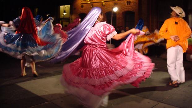 Mexican women twirl during an Independence Day celebration