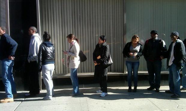 City workers line up outside the Department of Education to sign up for tier IV pension.