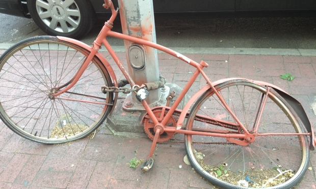 Abandoned orange bike