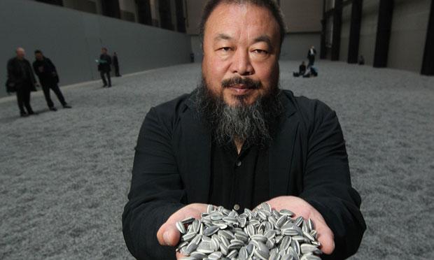 Chinese Artist Ai Weiwei holds some seeds from his Unilever Installation 'Sunflower Seeds' at The Tate Modern. Chinese Artist Ai Weiwei holds some seeds from his Unilever Installation 'Sunflower Seeds' at The Tate Modern.