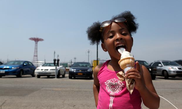 Image of a warmer summer: 4-year-old Alani Williams in 2011 at Coney Island. Alani Williams, 4, from Midwood having some ice cream at the beach at Coney Island.