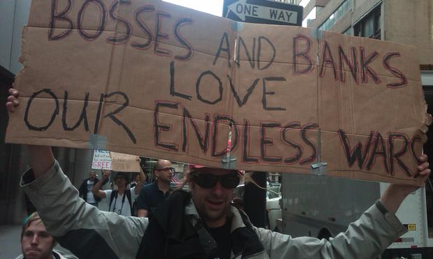 Demonstrators marching through the financial district