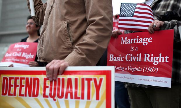 Opponents of Proposition 8, California's anti-gay marriage bill, hold signs outside of the Ninth U.S. Circuit Court of Appeals on February 7, 2012 in San Francisco, California.