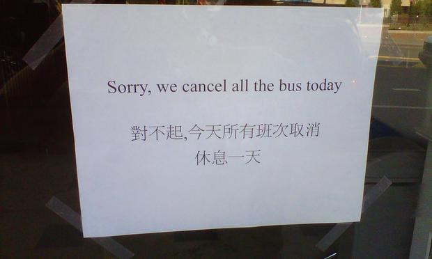 Storefront sign in Manhattan's Chinatown announces shut-down of the Sky Express Bus Company.